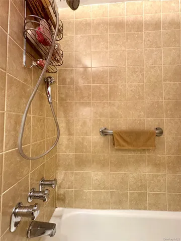 a utility room with dryer washer and other items