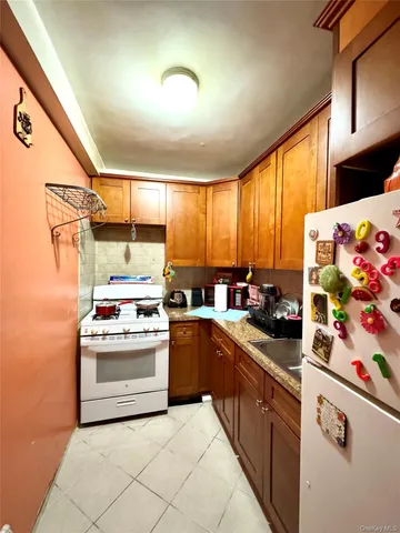 a kitchen with stainless steel appliances a stove a sink and a microwave