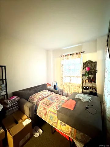 a view of a room with furniture and a chandelier