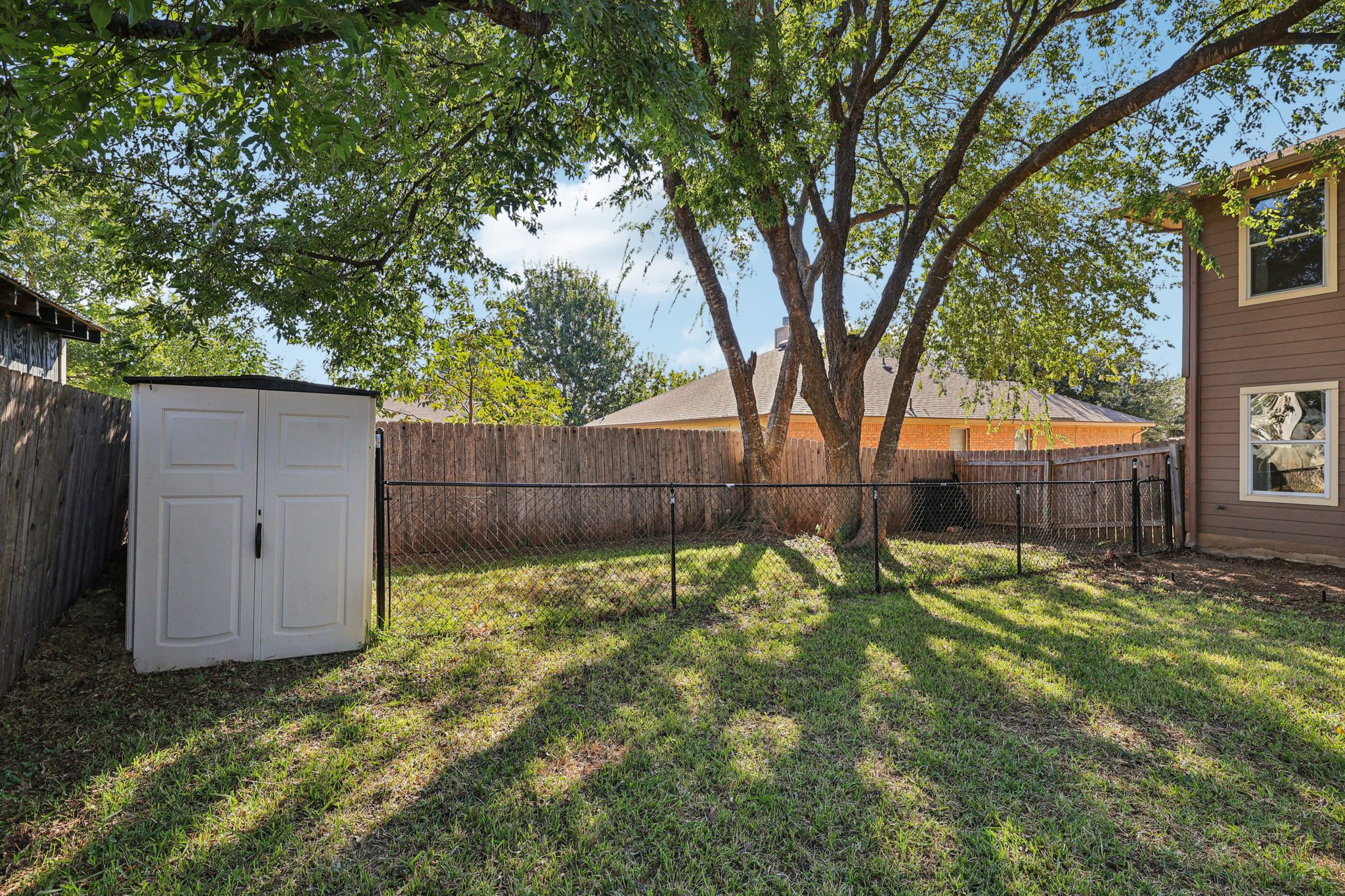 309 Pheasant Ridge Drive Round Rock, TX 78665 - Photo 23 of 39 The Backyard offers a Storage Shed and a Convenient Fenced Dog Run Space