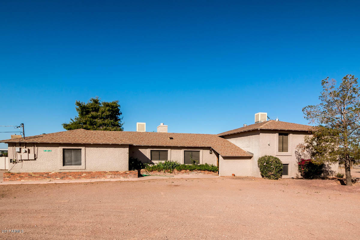 41568 North Rattlesnake Road San Tan Valley, AZ 85140 - Photo 1 of 32 a front view of a house with a yard and garage