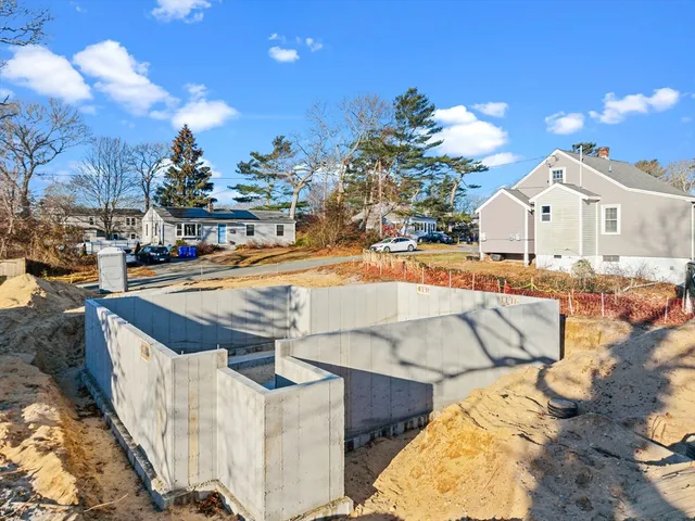 a view of a backyard patio and fire pit