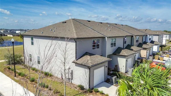 an aerial view of a house with outdoor space