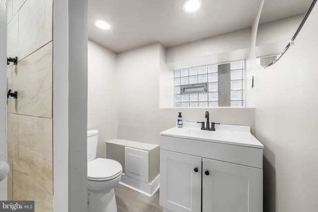 a front view of a residential apartment building with a yard