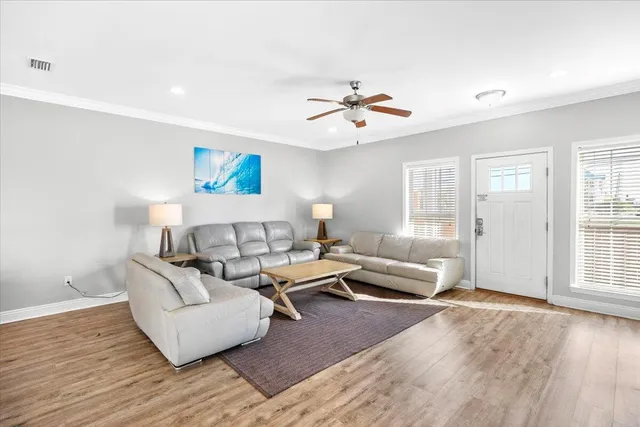 a view of a house with backyard and wooden floor