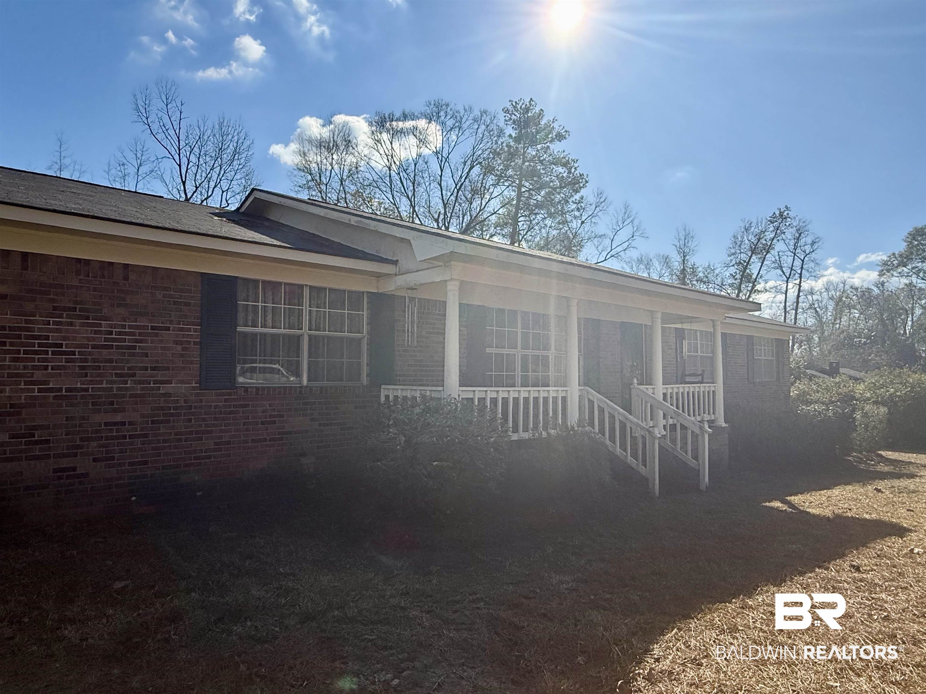 215 Young Street Brewton, AL 36426 - Photo 25 of 25 View of front of property featuring a porch and brick siding