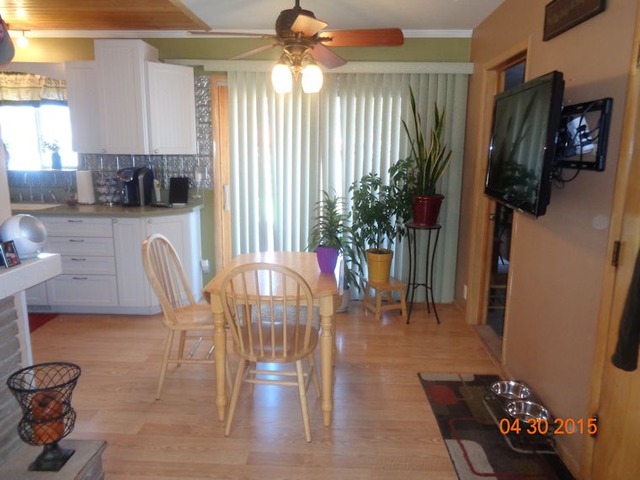 1001 North 3rd Street Rochelle, IL 61068 - Photo 4 of 12 a view of a dining room with furniture and wooden floor