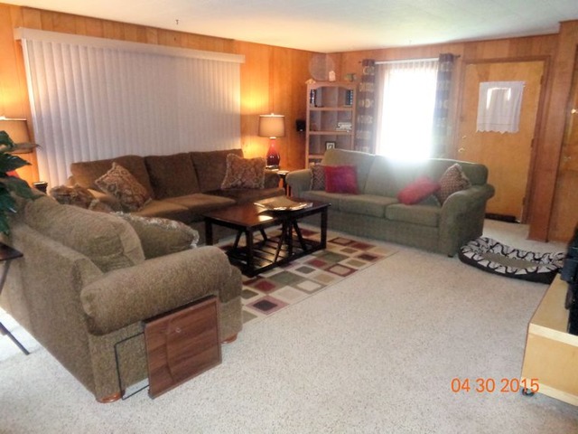 1001 North 3rd Street Rochelle, IL 61068 - Photo 7 of 12 a living room with furniture and a window
