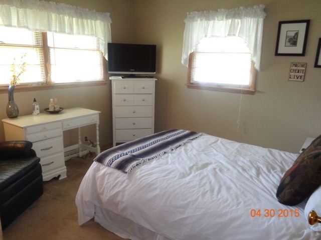 1001 North 3rd Street Rochelle, IL 61068 - Photo 9 of 12 a bedroom with a bed and a window