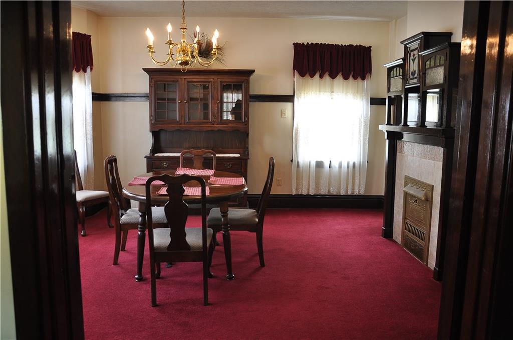343 Roosevelt Road Pittsburgh, PA 15237 - Photo 12 of 25 Spacious dining room, with decorative fireplace and one of a kind built in custom antique fireplace mantel and china cabinet.