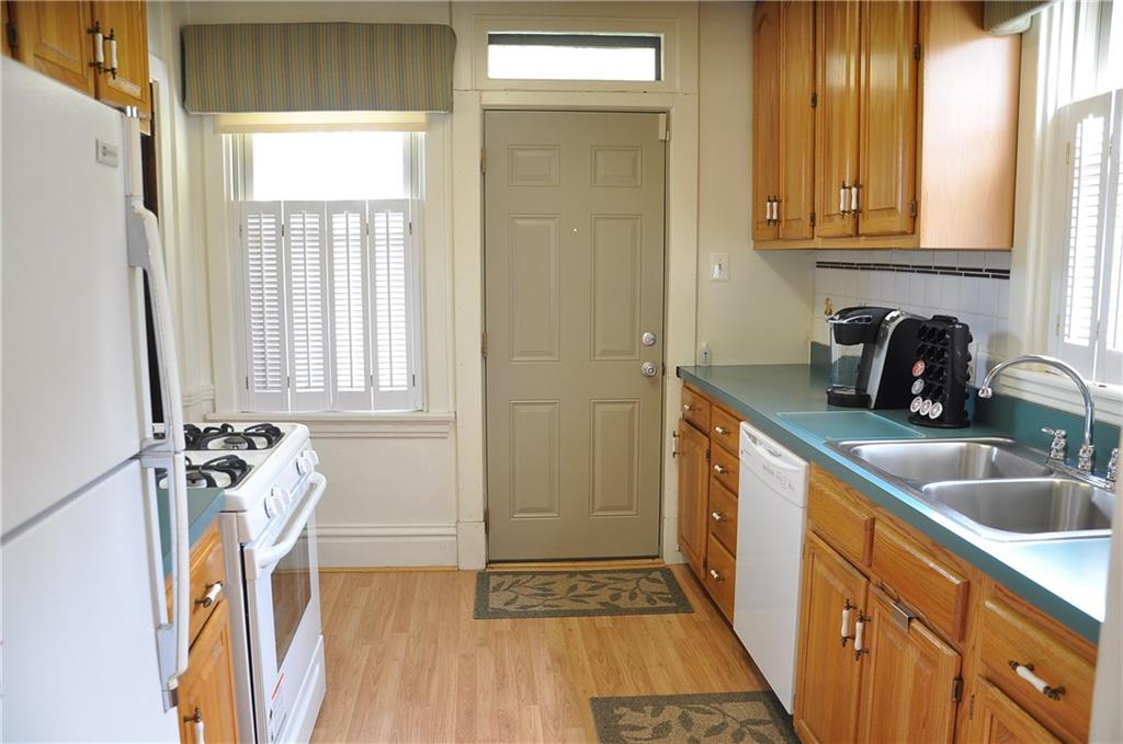 343 Roosevelt Road Pittsburgh, PA 15237 - Photo 13 of 25 Kitchen with brand new gas stove, never used. Back door opens to back porch and large private yard, walk way to detached garage.