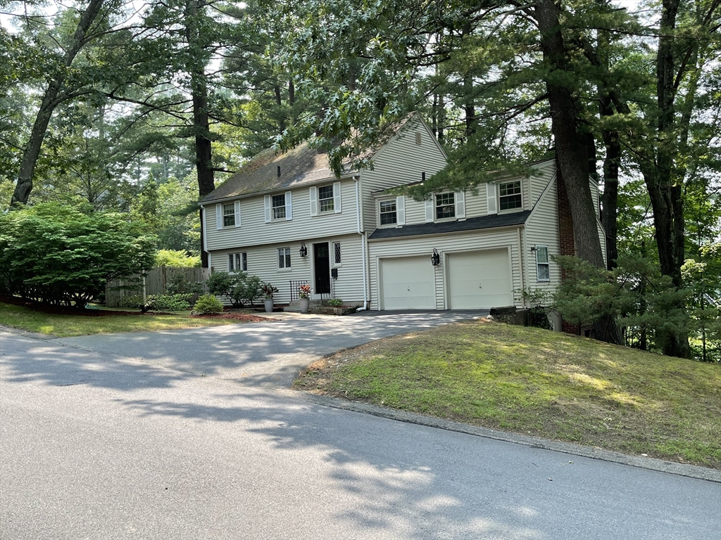 5 Temple Road Wellesley, MA 02482 - Photo 1 of 1 a front view of a house with a garden and trees