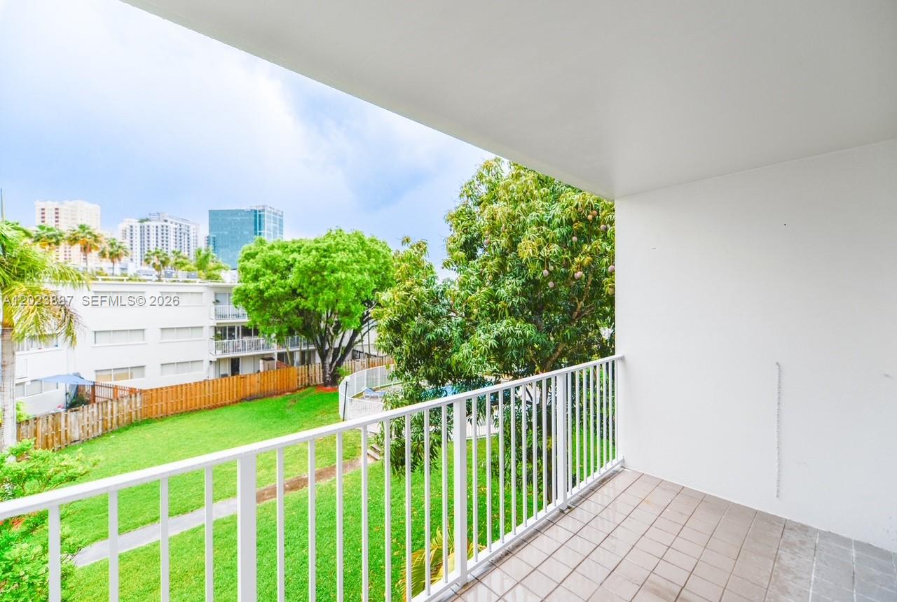 7737 Southwest 88th Street, Unit C312 Miami, FL 33156 - Photo 2 of 32 a view of a balcony with an outdoor space