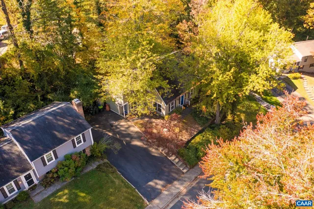 front view of a house with a tree