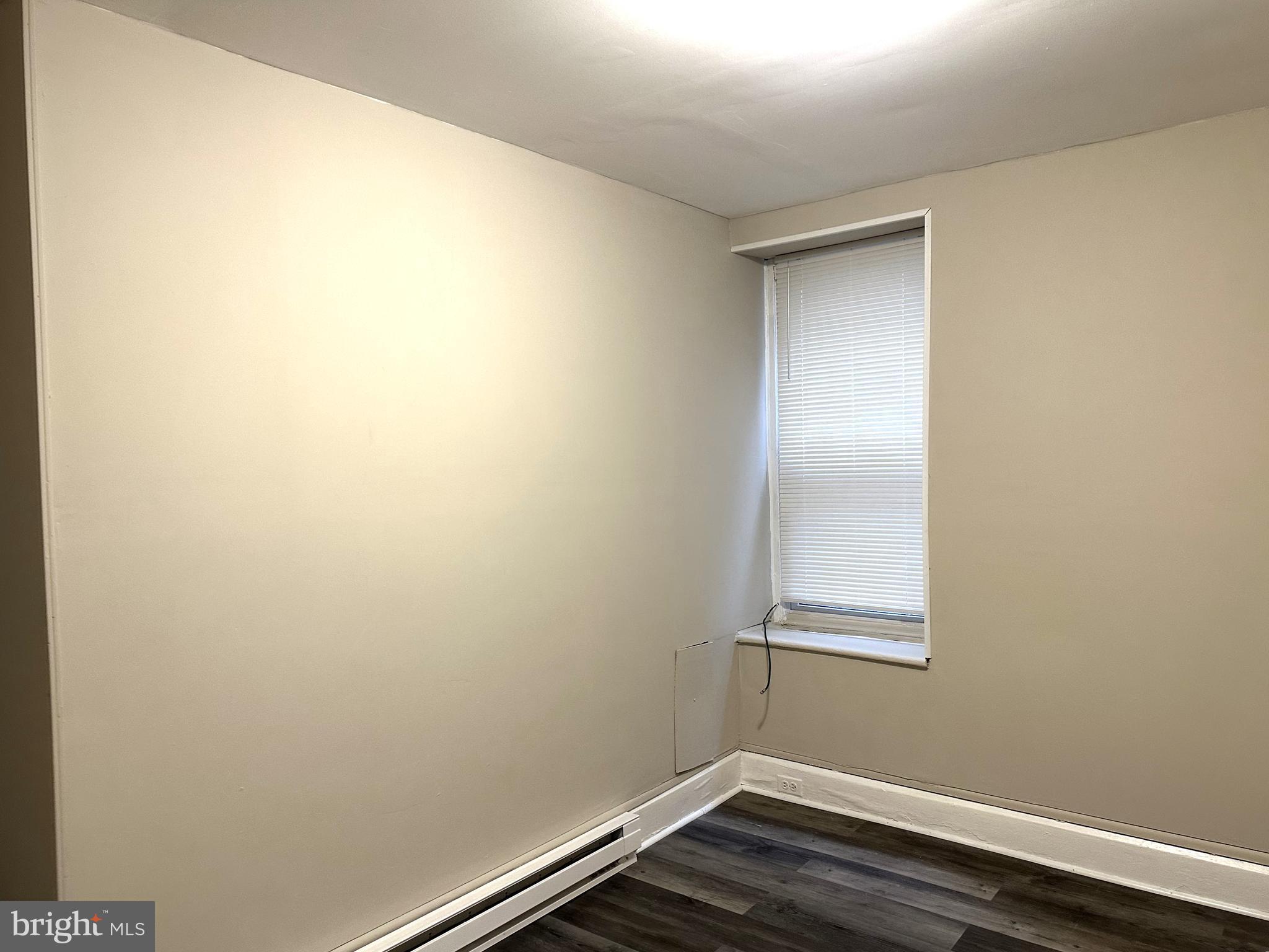 425 Highland Avenue, Unit A Chester, PA 19013 - Photo 15 of 24 a view of small space with wooden floor