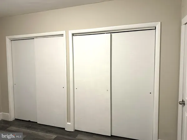 a bathroom with a glass shower door