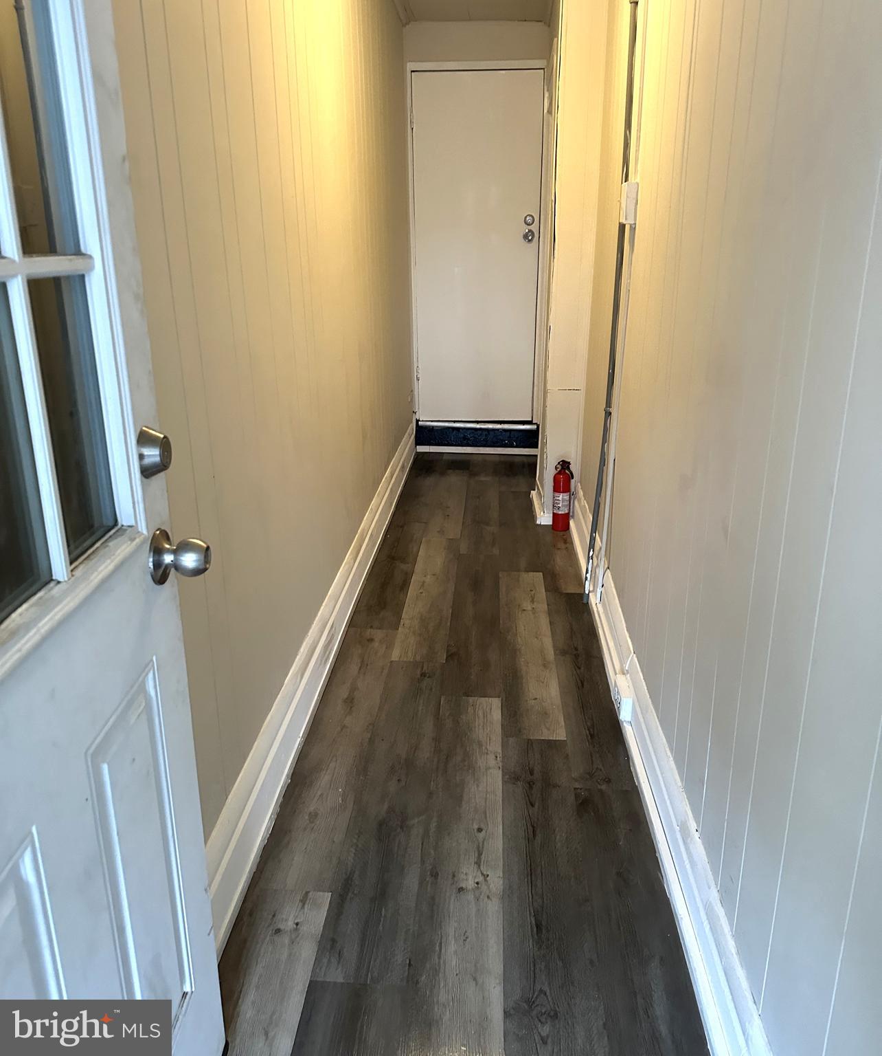 425 Highland Avenue, Unit A Chester, PA 19013 - Photo 2 of 24 a view of a hallway with wooden floor and staircase