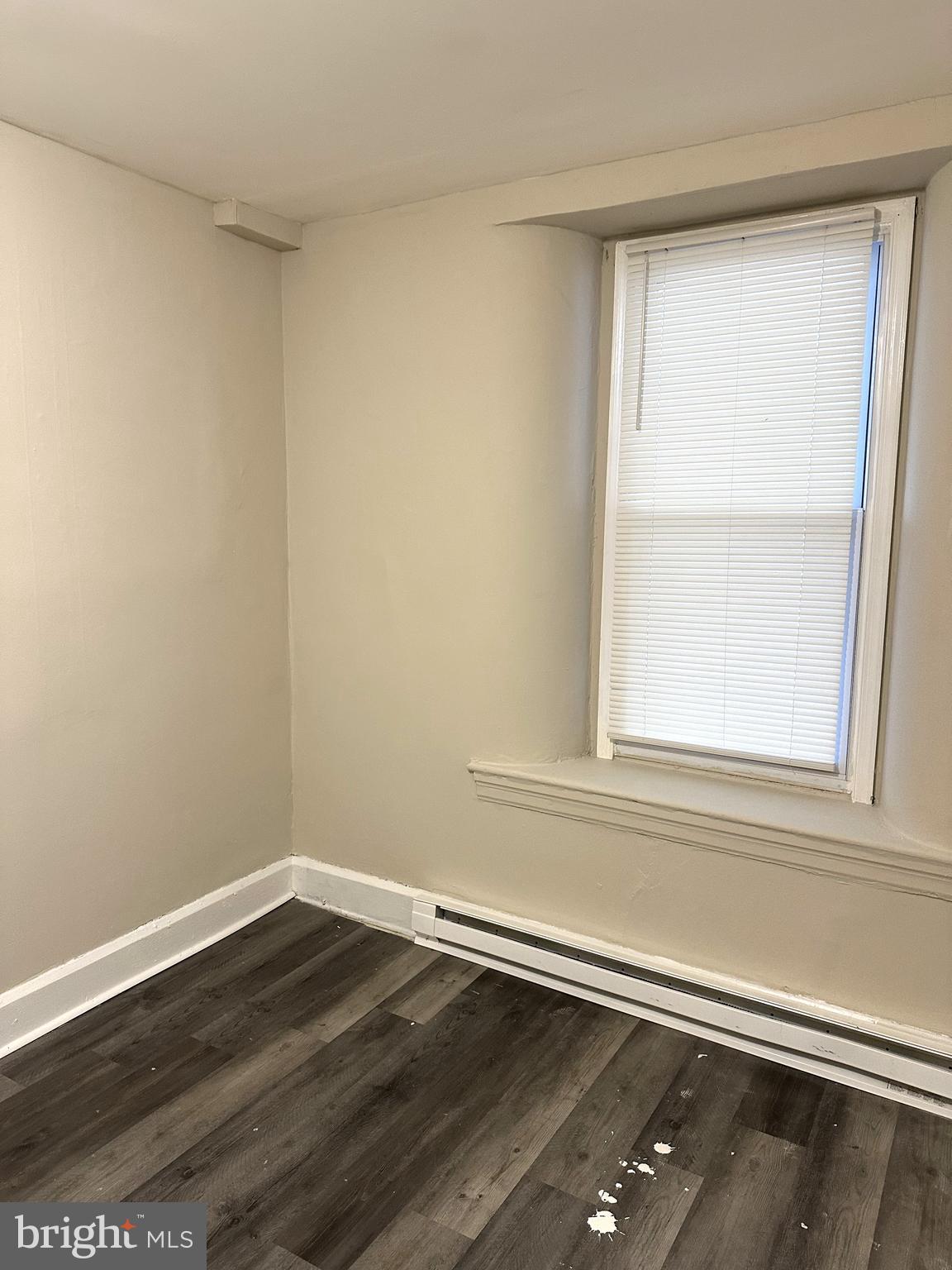 425 Highland Avenue, Unit A Chester, PA 19013 - Photo 22 of 24 a view of a small space with wooden floor and a window