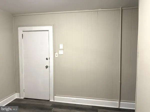 a bathroom with a glass shower door