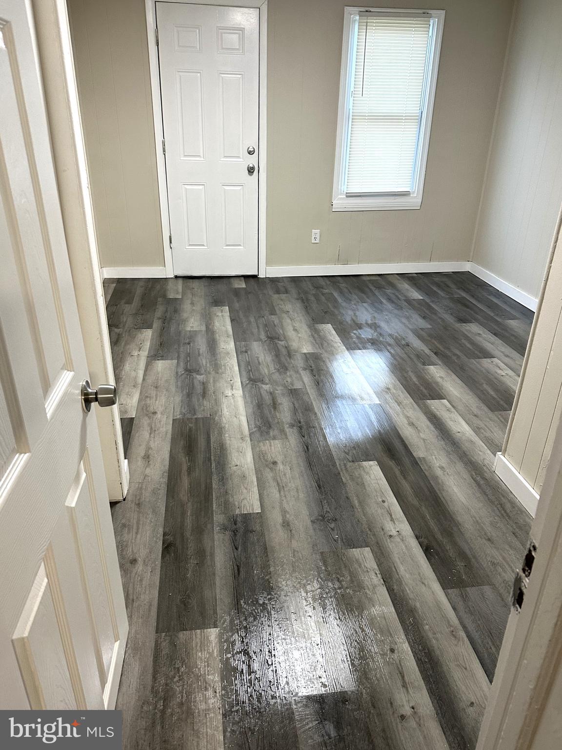425 Highland Avenue, Unit A Chester, PA 19013 - Photo 9 of 24 a view of an empty room and wooden floor