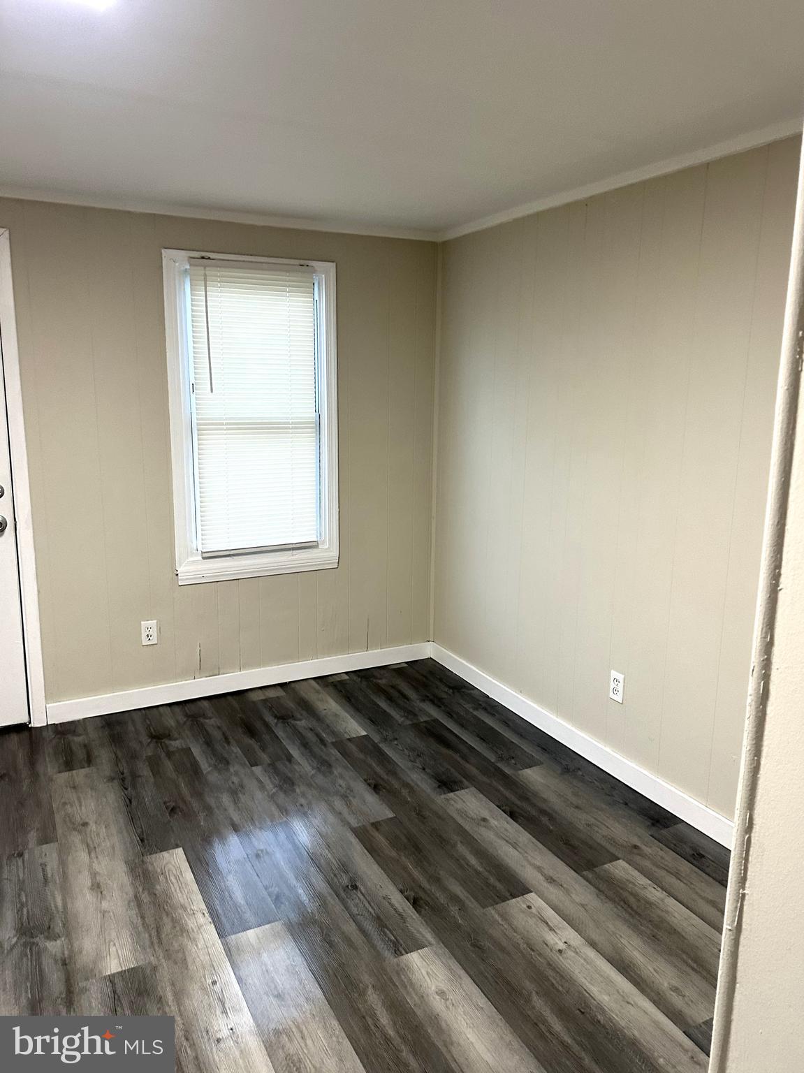 425 Highland Avenue, Unit A Chester, PA 19013 - Photo 10 of 24 an empty room with wooden floor and windows