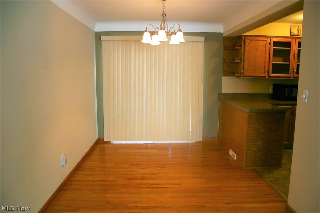 6841 Revere Road Cleveland, OH 44130 - Photo 5 of 31 Dining room leading into kitchen*2012 Window treatments*