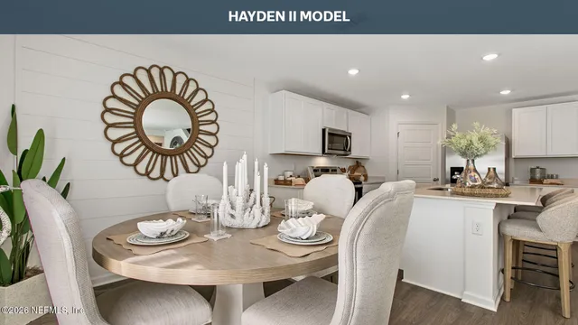 a large bed sitting in a bedroom next to a window