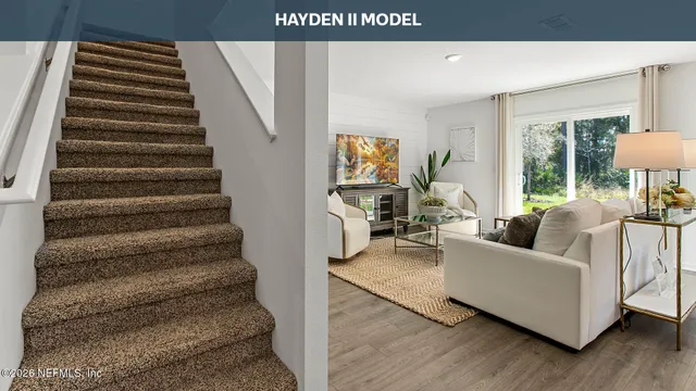 a living room with furniture a window and a flat screen tv