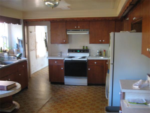 36 Great Road Maynard, MA 01754 - Photo 6 of 17 a kitchen with stainless steel appliances granite countertop a refrigerator a sink a stove and wooden cabinets