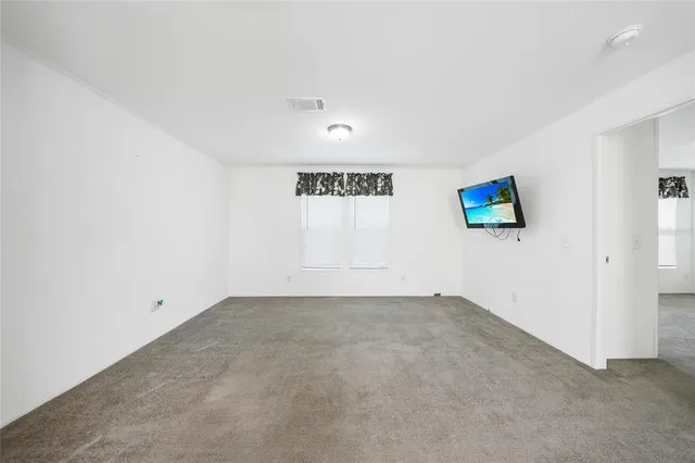 a bathroom with a granite countertop sink a mirror and a shower