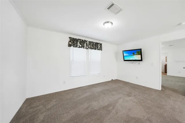 a bathroom with a granite countertop sink and a toilet
