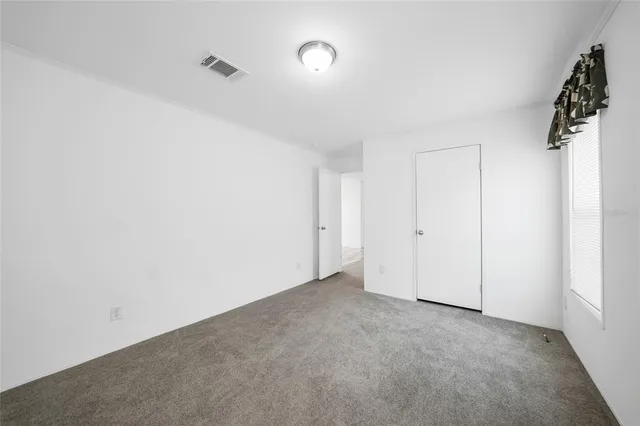 a view of a house with backyard porch and garden