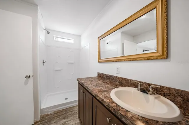 an aerial view of a residential houses with outdoor space