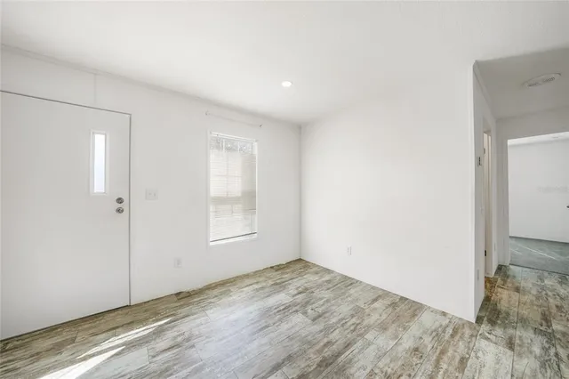 a bathroom with a granite countertop sink and a bathtub