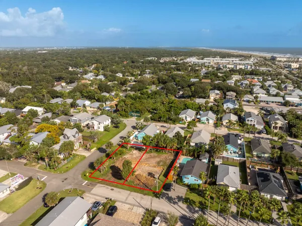 an aerial view of residential building with green space