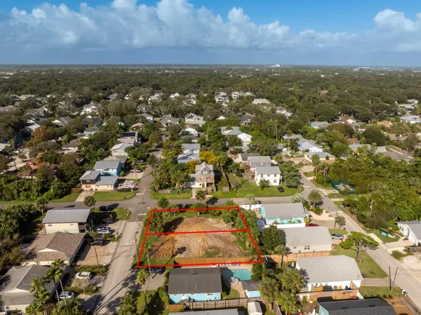 an aerial view of residential building with green space