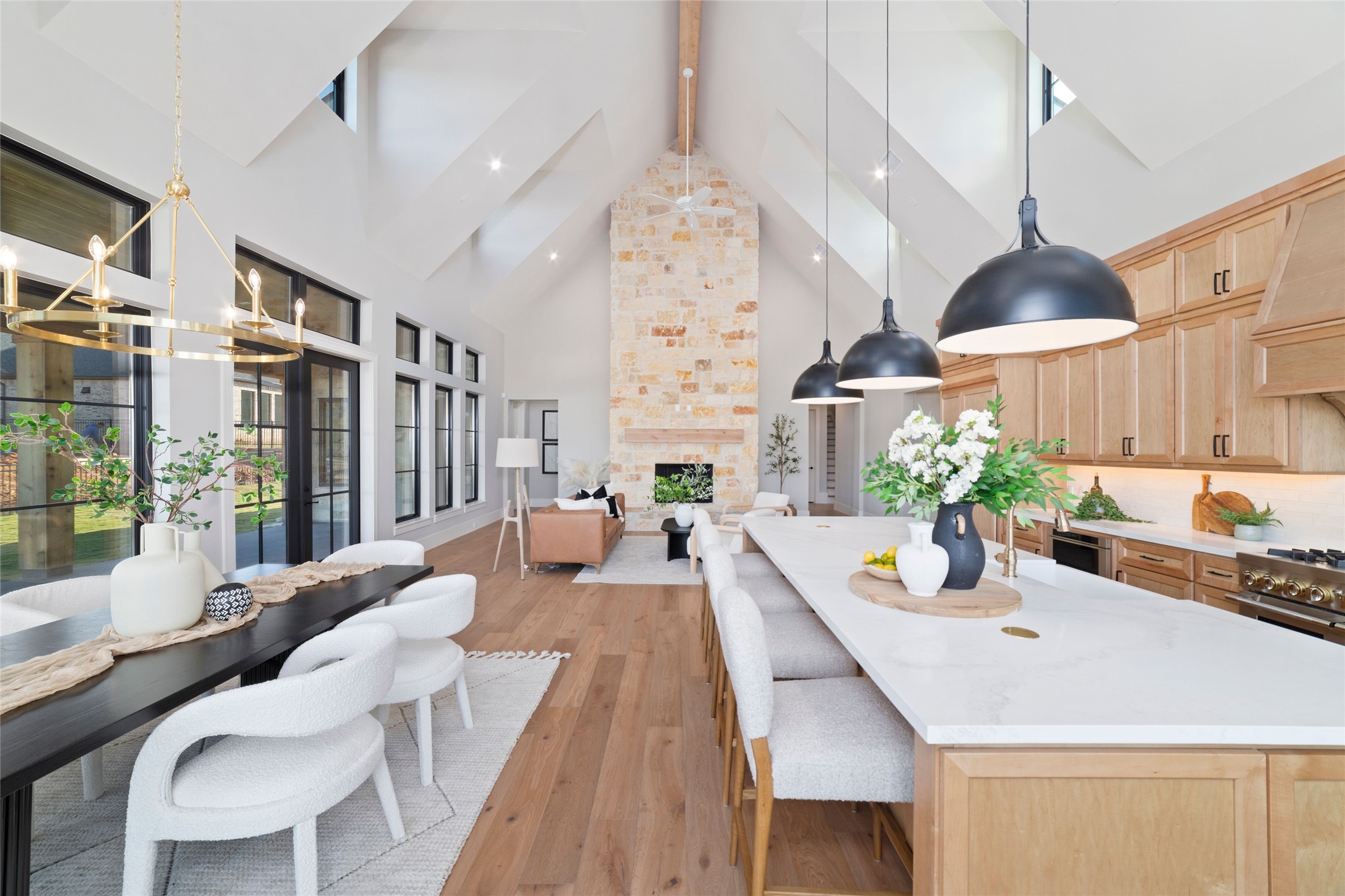 14130 Ripple Ridge Drive Willis, TX 77318 - Photo 25 of 38 a dining room with furniture a chandelier and wooden floor