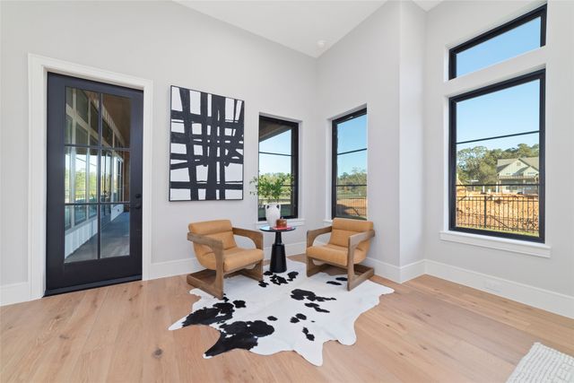 a living room filled with furniture and a potted plant