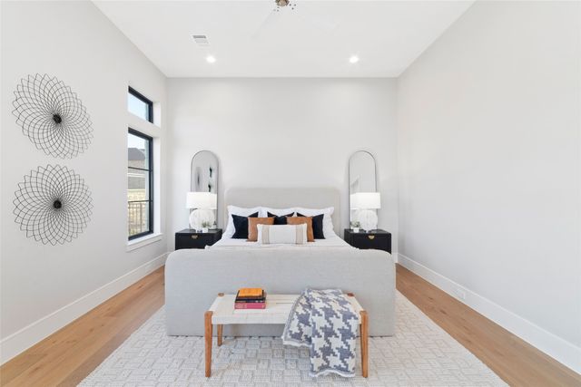a bedroom with furniture and natural light