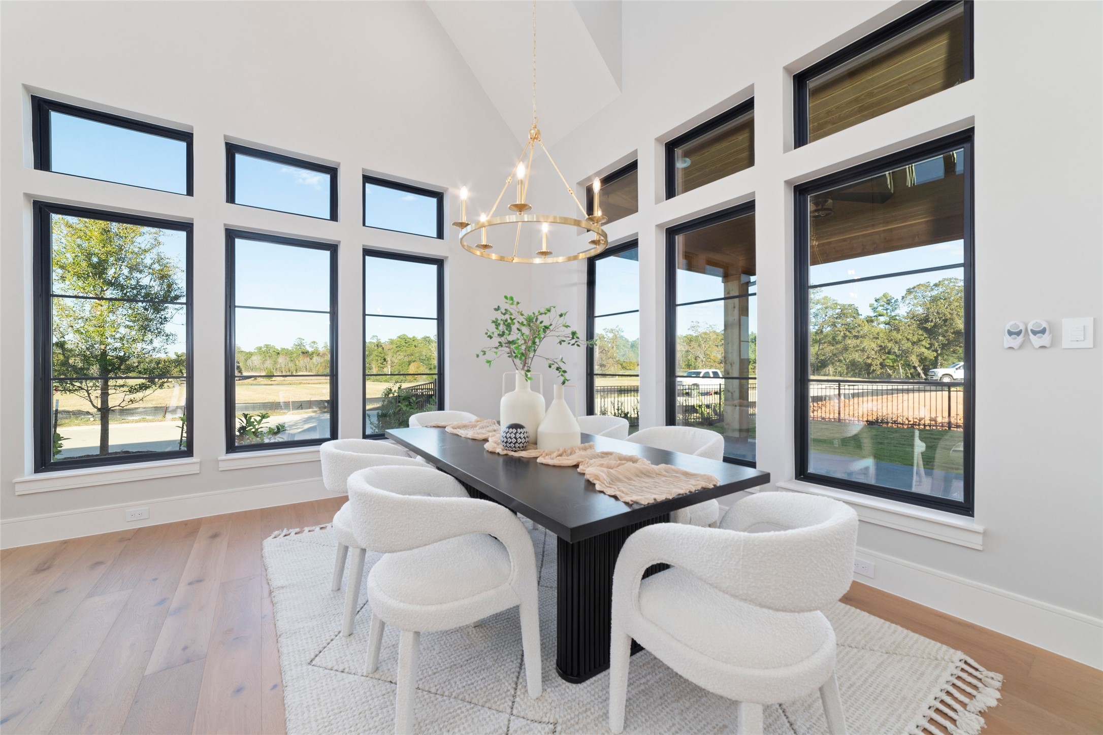 14130 Ripple Ridge Drive Willis, TX 77318 - Photo 3 of 38 a dining room with furniture a chandelier and wooden floor