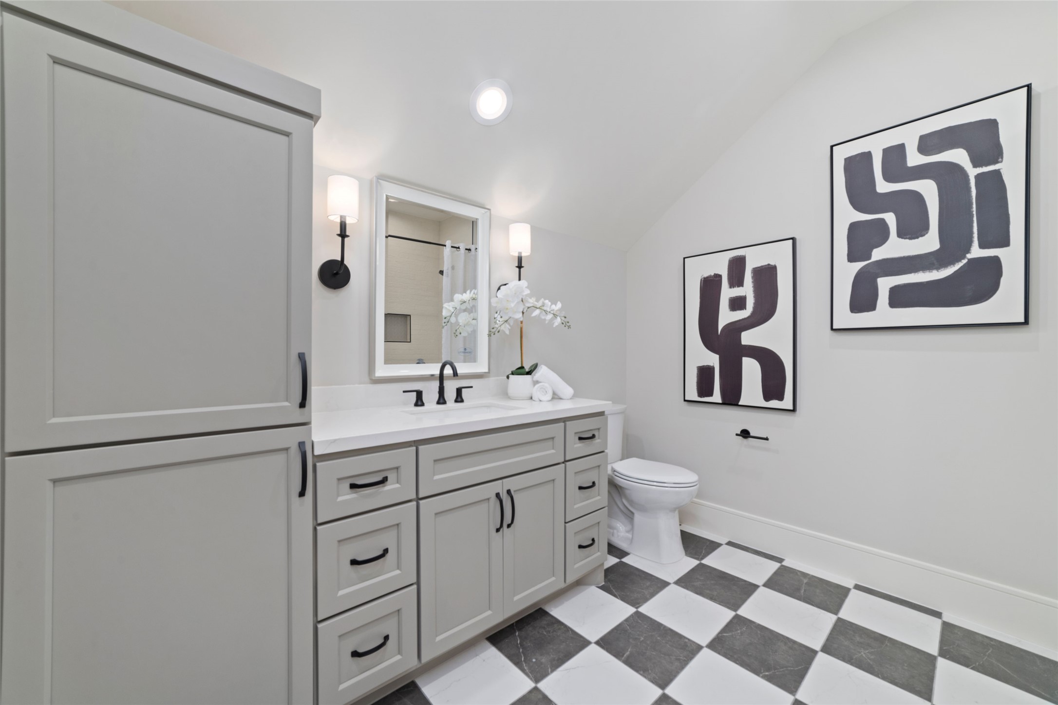 14130 Ripple Ridge Drive Willis, TX 77318 - Photo 35 of 38 a bathroom with a toilet sink and mirror