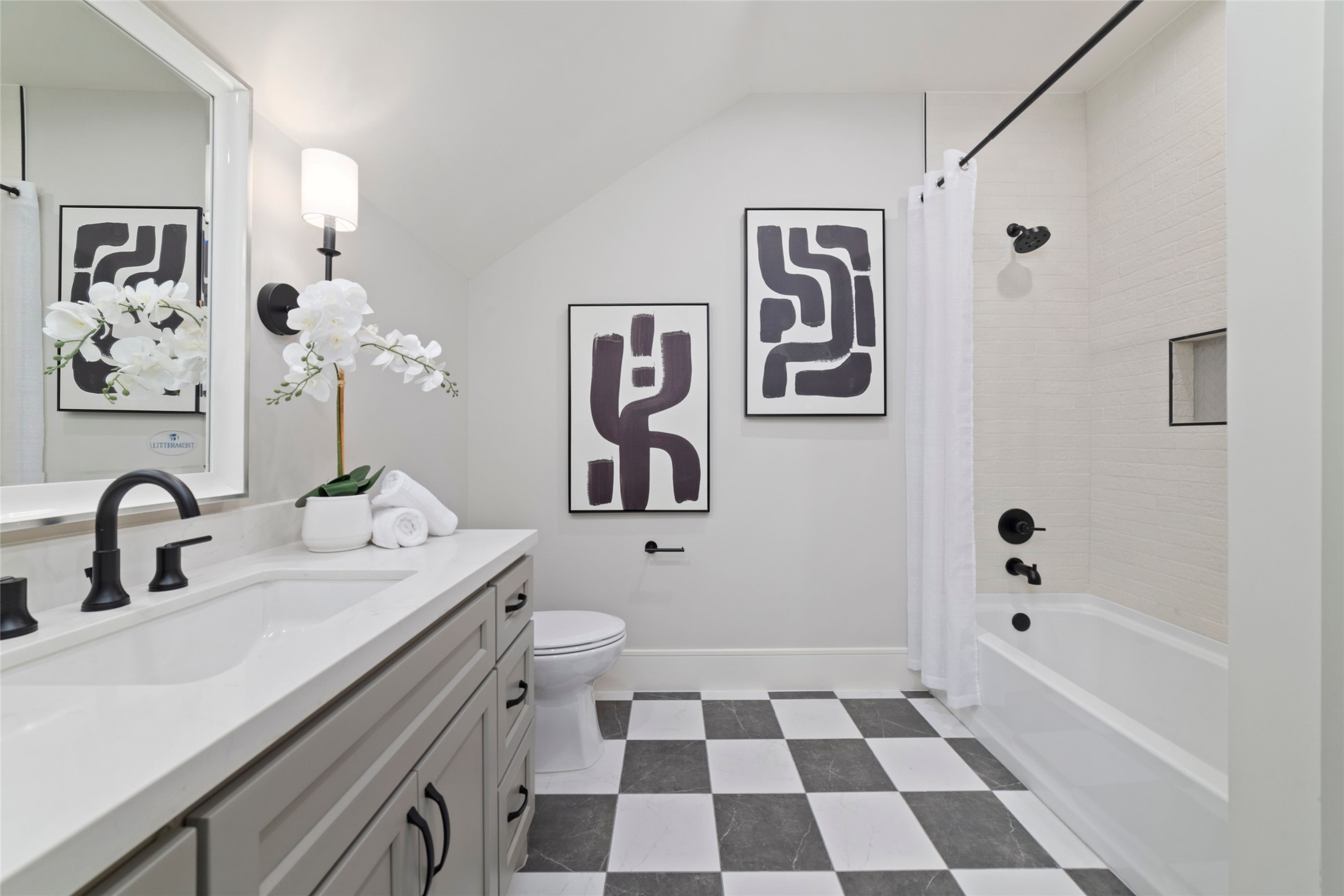 14130 Ripple Ridge Drive Willis, TX 77318 - Photo 36 of 38 a bathroom with a sink a mirror a toilet and a bathtub