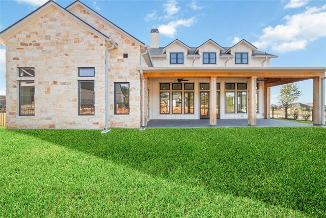 front view of a building with a garden