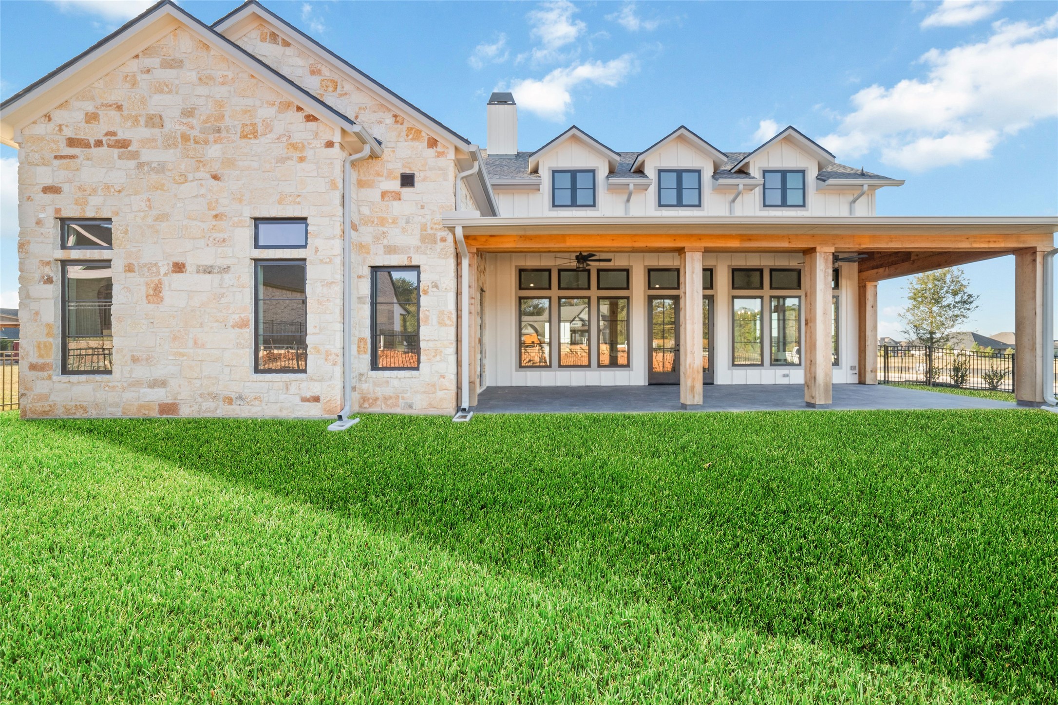14130 Ripple Ridge Drive Willis, TX 77318 - Photo 7 of 38 front view of a building with a garden
