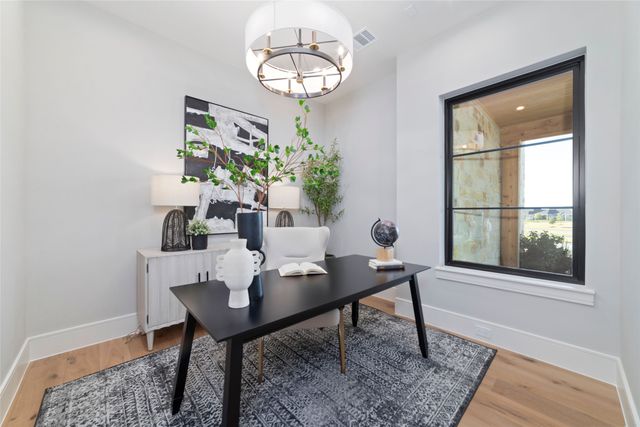 a view of a dining room with furniture and a window