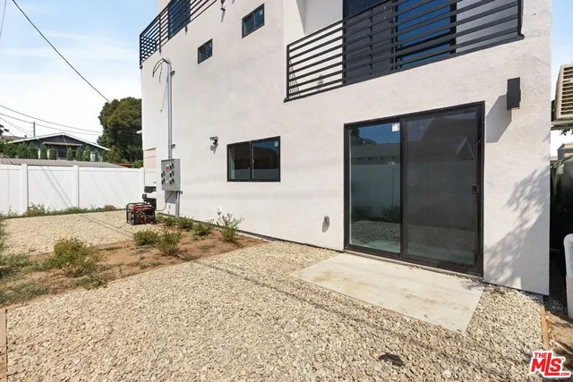a view of a backyard of a house