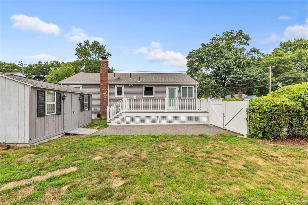 139 Prouty Street Springfield, MA 01119 - Photo 12 of 14 a front view of a house with a yard and garage