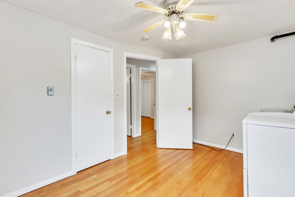 139 Prouty Street Springfield, MA 01119 - Photo 10 of 14 a view of an empty room with wooden floor