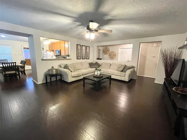 a living room with fireplace furniture and a flat screen tv