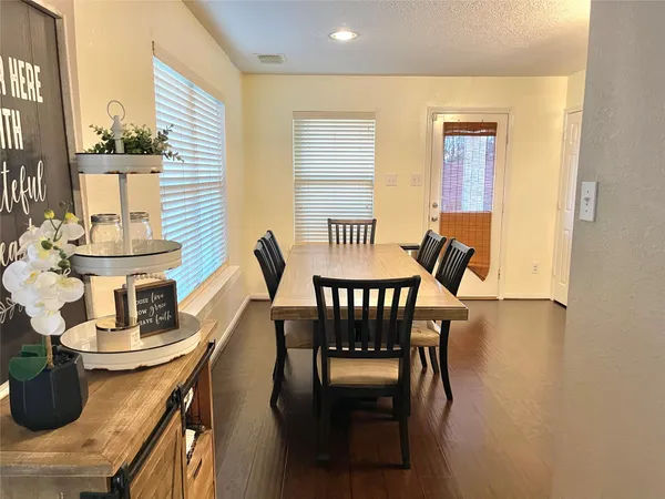 a view of a dining room with furniture and window